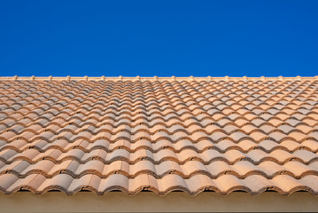 Ceramic top roof / ceramic tile roof in wave shape overlay stack with clear blue sky