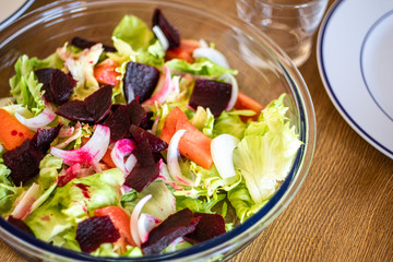salad with tomato, lettuce, beet, onion, vinegar