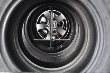 Stacked Car Tires with Alloy Wheel Center View