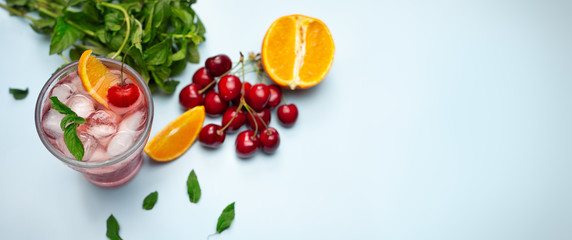 Background with cold cherries and orange  juice