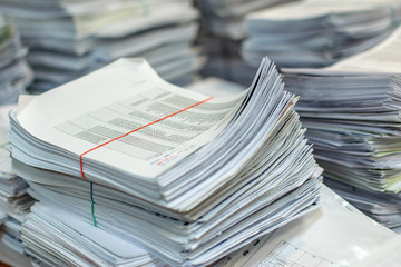 bundles bales of paper documents. stacks packs pile on the desk in the office