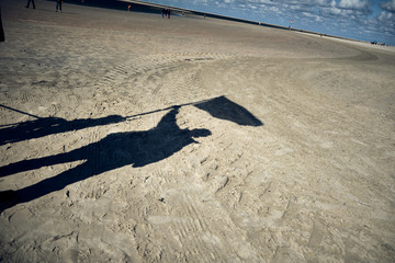 shadow of a guy on the beach 