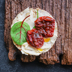 sun-dried tomatoes, sandwich appetizer snack (bruschetta) menu concept. background. top view. copy space