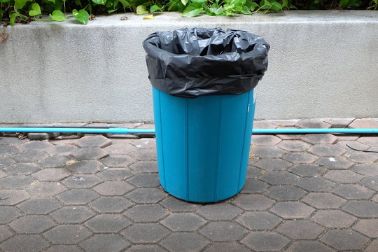 Plastic bins are placed in public places so people can throw away unused things and protect the environment.