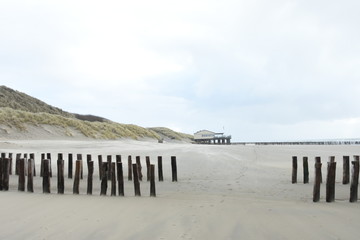 beach restaurant on Dutch coast with breakwaters 