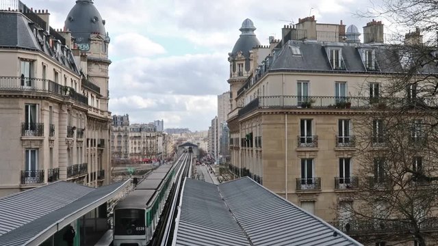 Metro entering Passy station coming from Bir-Hakeim station in Paris, France