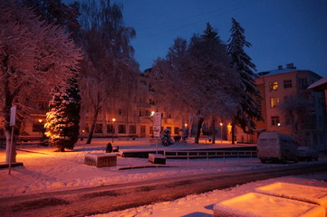 Snowy winter city in the night.