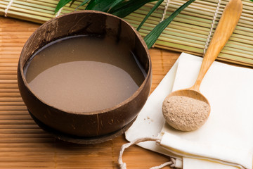 Kava drink made from the roots of the kava plant mixed with water - obrazy, fototapety, plakaty