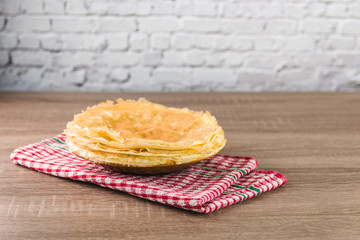 healthy sweet breakfast. yummy traditional thin pancakes from rice flour on wooden table