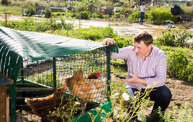 Man proffesional farmer  near chicken house outdoor © JackF