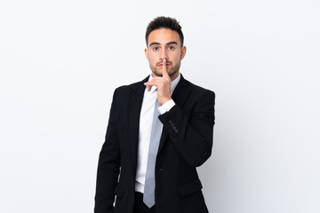Young business man over isolated background doing silence gesture