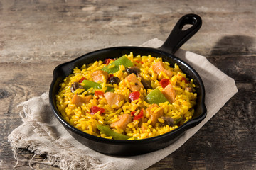 Fried rice with chicken and vegetables on frying iron pan