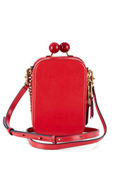 Elegant women's handbag made of red leather with a chain strap in a buttoned form, isolated on a...