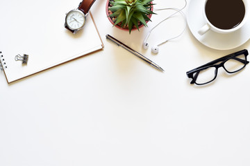 Top view white table, Design your own desk with book, pen, glasses, black coffee and wristwatch is elements.