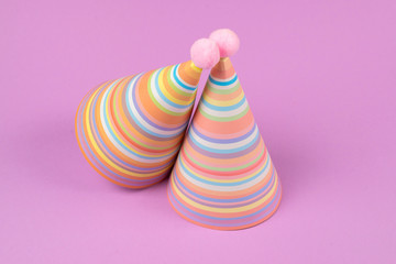 Birthday cap on pink background.