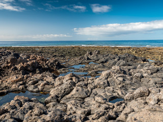 Fototapeta na wymiar Beautiful landscape of cliff and coral reefs at the ocean coast