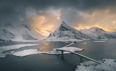 Volandstinden in a very famous and sharp mountain in Lofoten islands. Aerial drone photography. Winter sunset. Touristic and favorite spot for photographers and all tourist. Must see spot