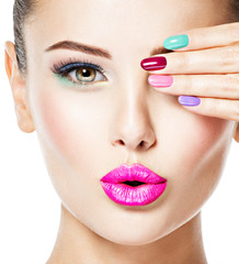 beautiful woman  with colored nails and fashion makeup