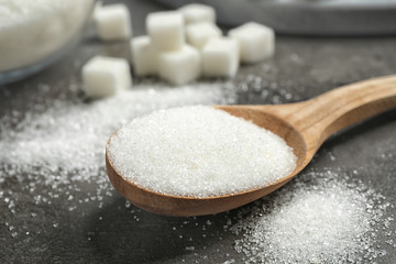 Composition with granulated sugar on grey table