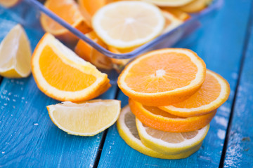 citrus fruits  orange and lemons on blue background