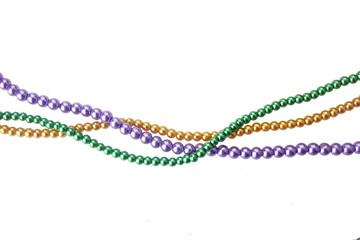 Three colors mardi gras beads for decoration isolated ob white background