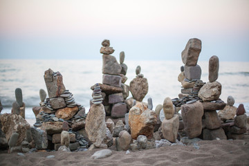 toy stone buildings on the beach