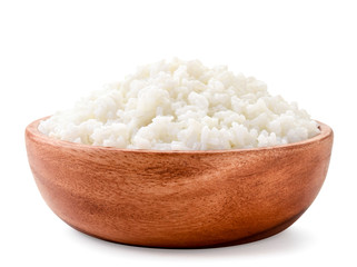Boiled rice in a wooden plate close-up on a white. Isolated