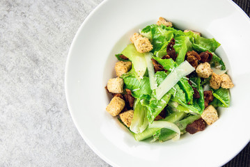 Salad with Grilled bacon, cesar salad served with Green Cos