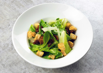 Salad with Grilled bacon, cesar salad served with Green Cos