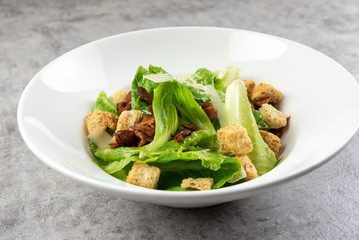 Salad with Grilled bacon, cesar salad served with Green Cos