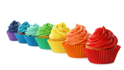 Delicious birthday cupcakes decorated with cream isolated on white