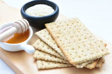 Fototapeta na wymiar Healthy sesame biscuits (Sesamum indicum) healthy whole grain honey cereal and coffee cup