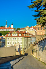 Fototapeta na wymiar View to red roofs, streets and green trees skyline of Prague city Czech republic.