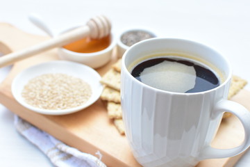 Healthy sesame biscuits (Sesamum indicum) healthy whole grain honey cereal and coffee cup