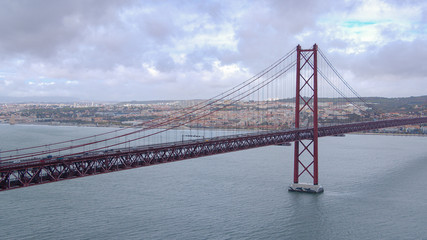 Famous 25th April Bridge over Tagus River n Lisbon - travel photography