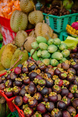 Fresh fruit market with mango, mangosteen and pineapple in Bali
