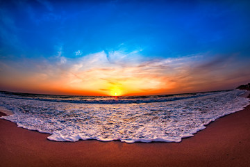 Beautiful view of the sea in the morning sunrise with lace like waves washing the shore, Vama Veche, Black Sea, Romania