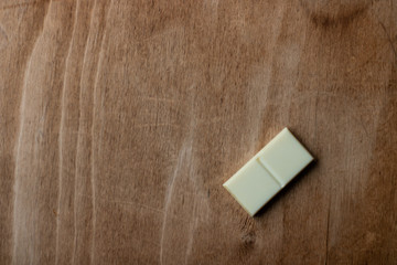 Dotless domino bone on a wooden surface. Dominoes