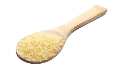 Parboiled rice pile in wooden spoon isolated on white background