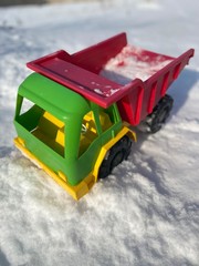  toy dump truck in the snow in winter