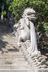 stone dragon statues in a temple in asia