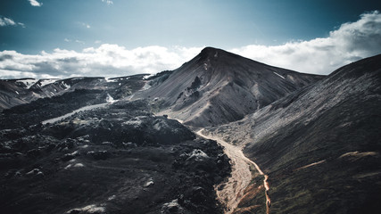 Aerial shot of Valley National Park Landmannalaugar. On the gentle slopes of the mountains are snow fields and glaciers. Magnificent Iceland in the summer