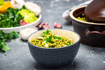 Bucketwheat Groats with Kale and Garlic. Healthy Plant Based Vegetarian Diet. Clean Eating. Food Background
