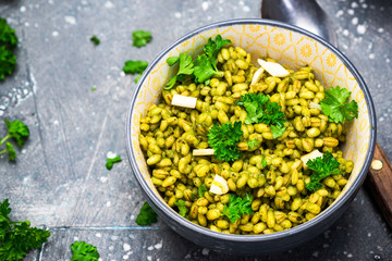 Bucketwheat Groats with Kale and Garlic. Healthy Plant Based Vegetarian Diet. Clean Eating. Food Background