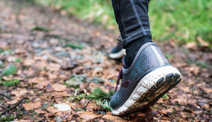 a woman jogging through the woods