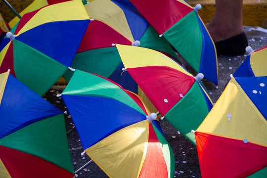 Recife / Pernambuco / Brazil. February, 11, 2018. Street carnival in downtown Recife. Trade in colorful parasols used by frevo dancers.