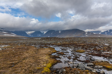 View of the valley. Northern Sweden, Sarek National Park in stormy weather. selective focus