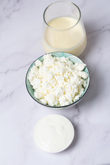 cottage cheese and milk on wooden table