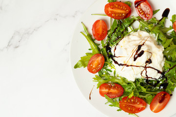 salad with tomatoes and mozzarella on white