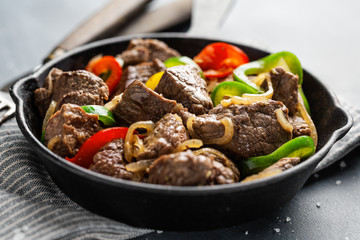 Cookef beef cuts with vegetables